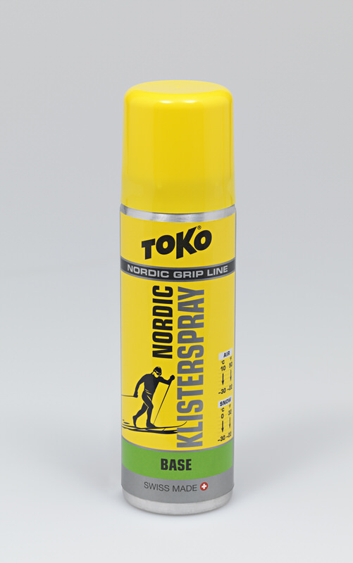 Gelbe Spraydose Toko Nordic KlisterSpray Base. Aufdruck: Logo, Langläufer-Silhouette, Temperaturbereich.