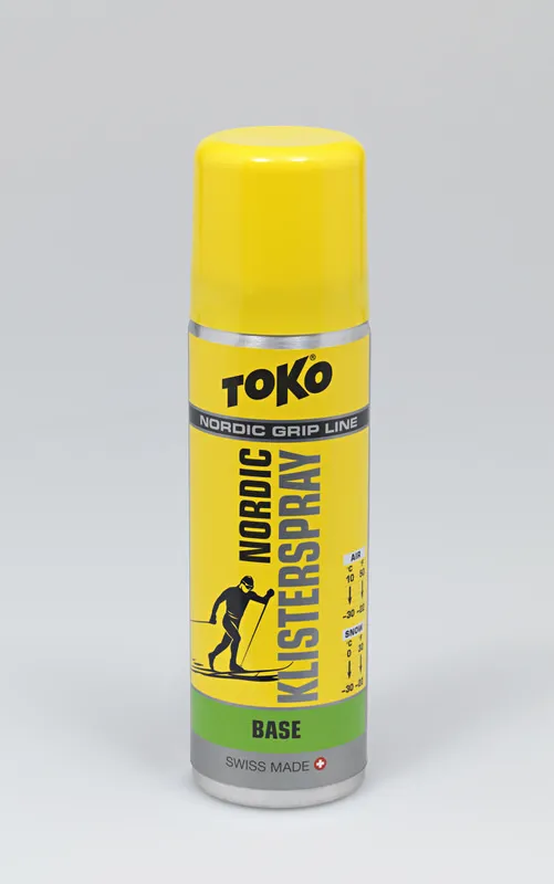 Gelbe Spraydose Toko Nordic KlisterSpray Base. Aufdruck: Logo, Langläufer-Silhouette, Temperaturbereich.