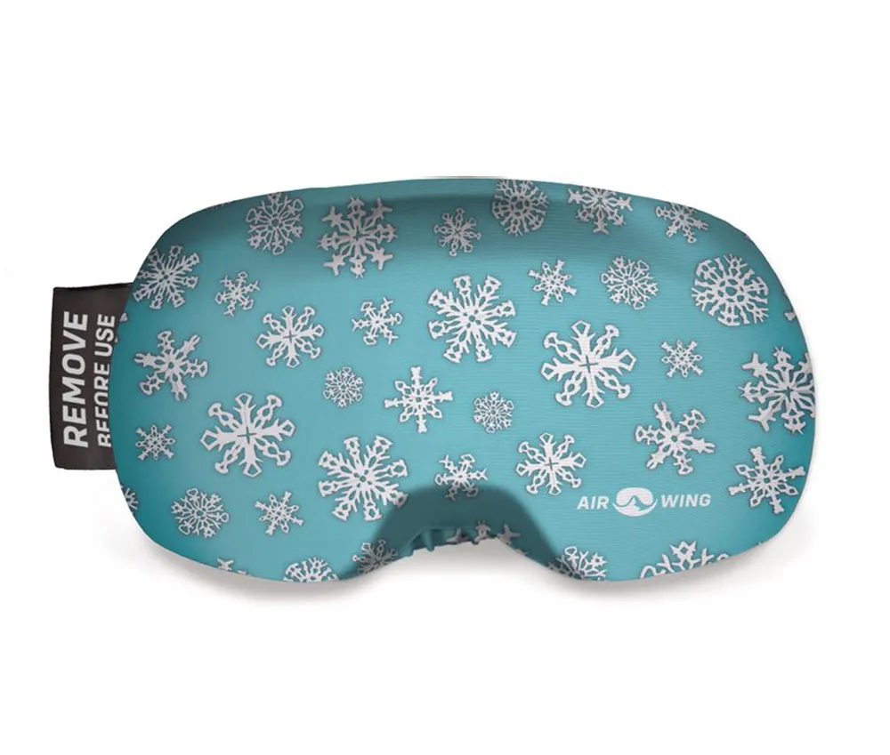Ski goggle protector "Airwing Snow" with snowflake pattern on light blue background. Black label: "Remove before use".