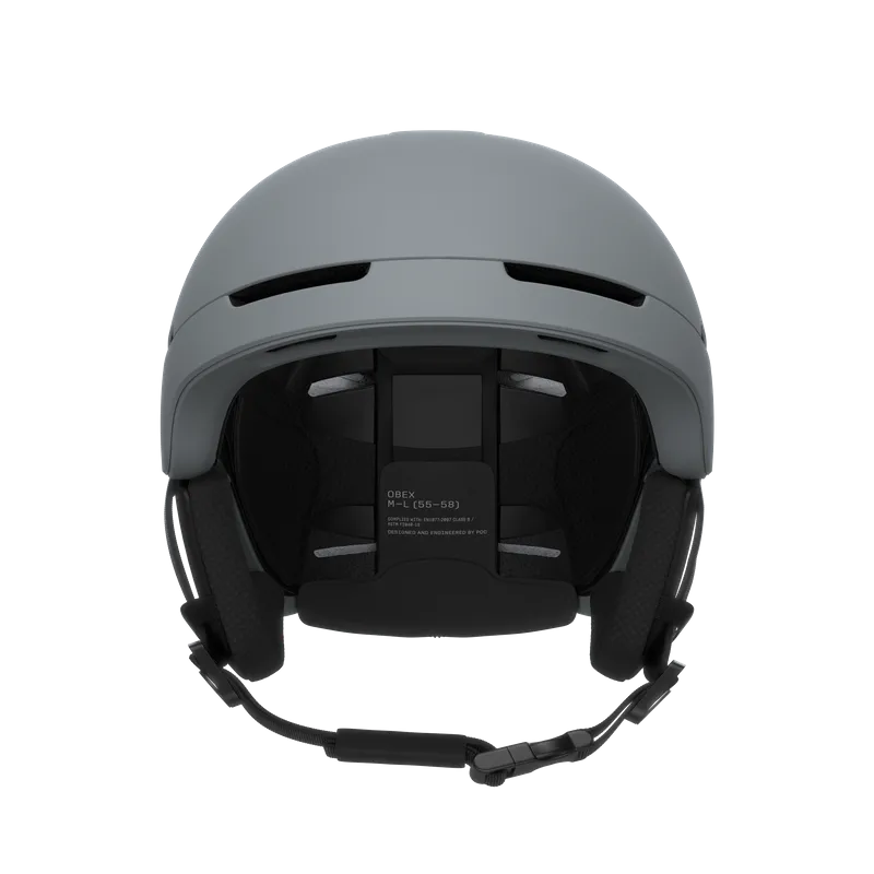 Front view of the matt, gray POC Obex MIPS ski and snowboard helmet, showing the inner workings and the locking mechanism.