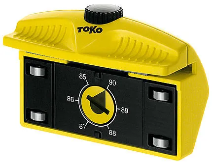 Gelber Toko Edge Tuner Pro mit Einstellrad für Kantenwinkel und Rollenführung.