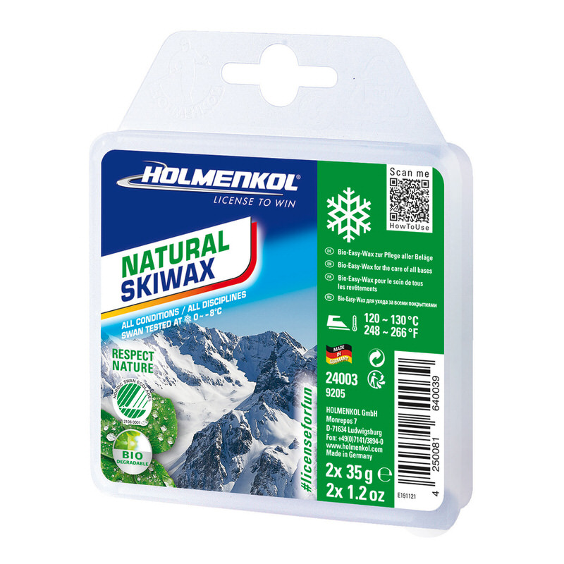 Emballage du fart de ski bio avec mention du fabricant, flocon de neige, montagnes et l'inscription "Natural Skiwax".