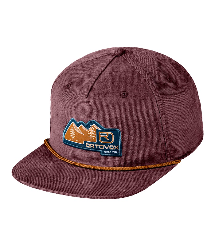 Wine-red corduroy visor cap with badge logo showing mountains and trees. A cord band runs along the peak.