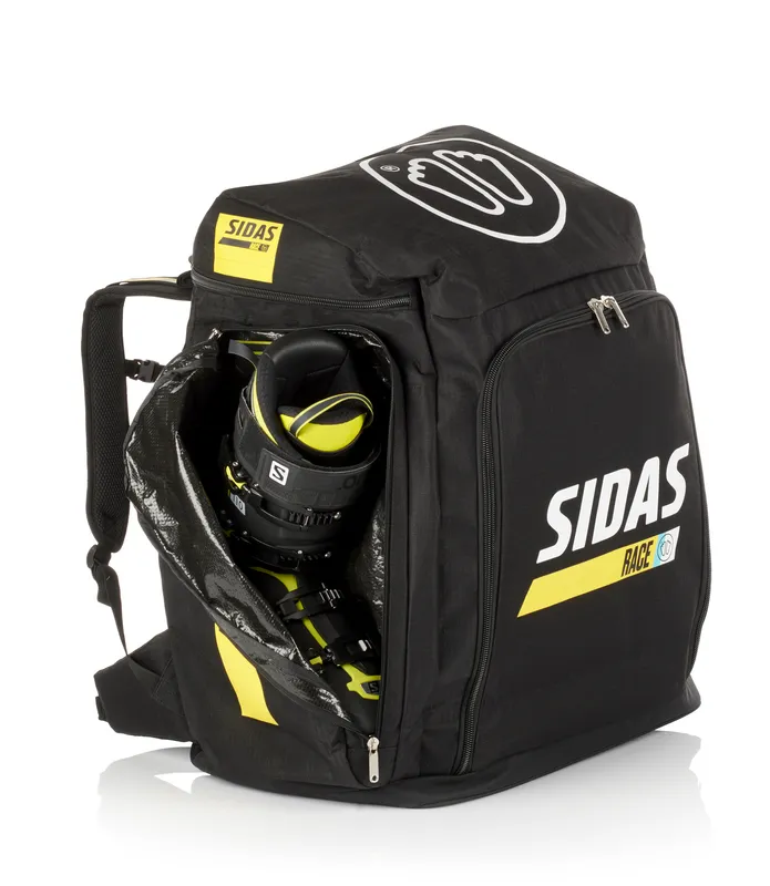 Schwarze Sidas Race Boot Bag mit Skischuh im geöffneten Fach, Logos und gelben Akzenten.