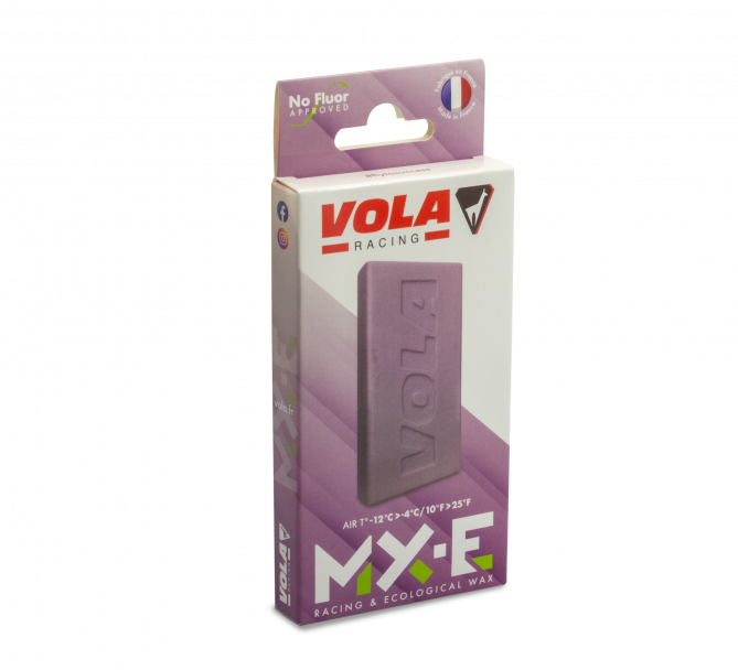 Verpackung des violetten Vola MX-E no Fluor Skiwachses. Das Wachs ist selbst auch sichtbar.