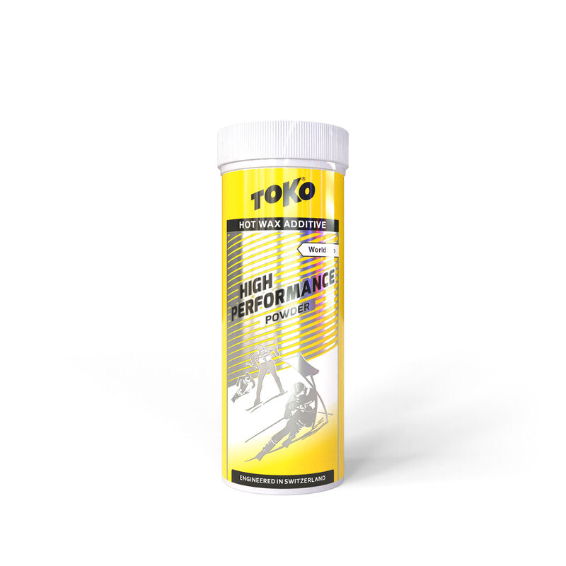 Gelbe Dose Toko High Performance Powder. Text: "Hot Wax Additive", Skifahrer-Illustration.