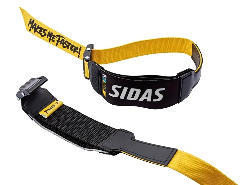 Yellow and black Sidas Power Strap with metal buckle for improved ski control and performance.