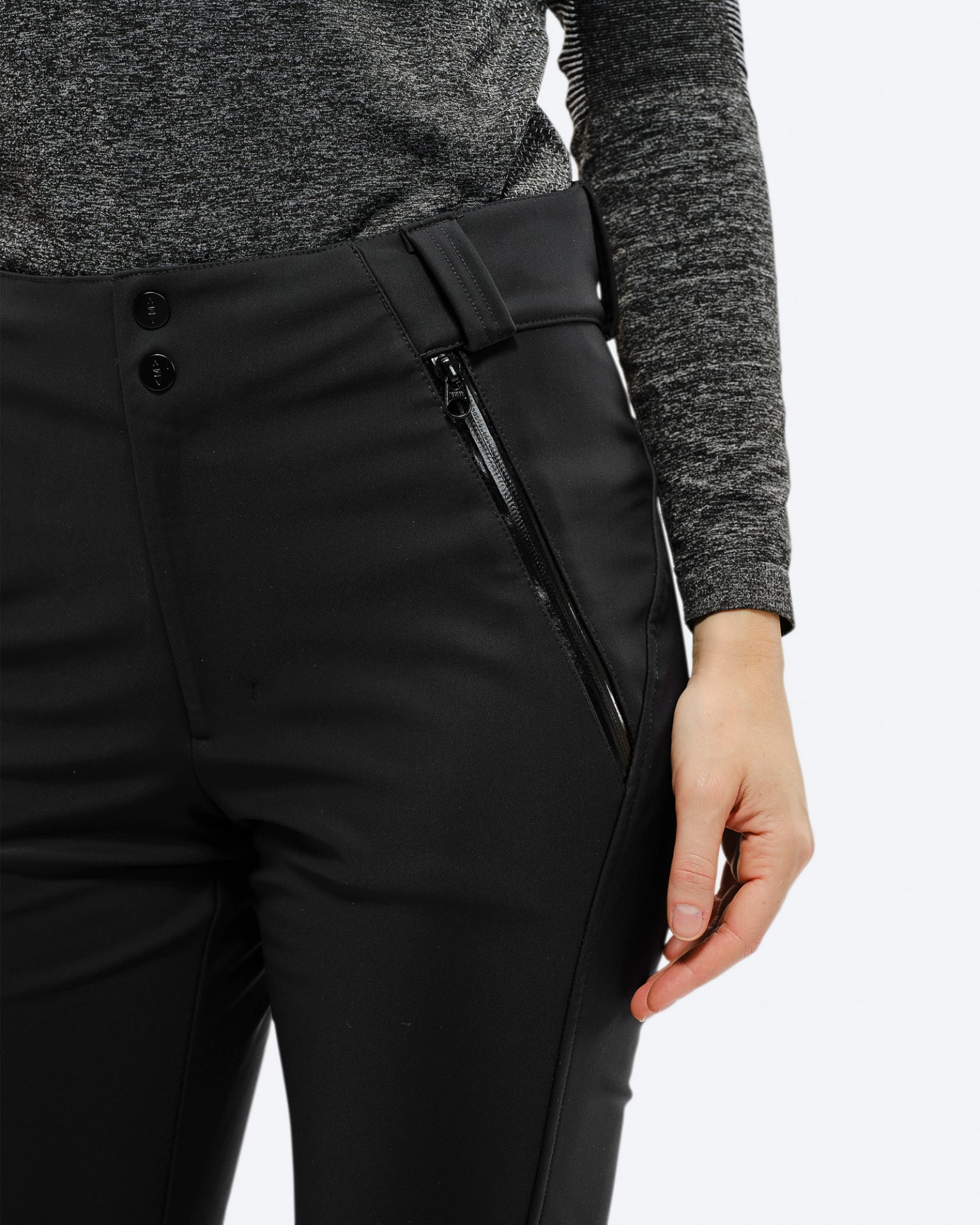 Black stretch ski pants Close-up of the black stretch ski pants with pocket zipper and waistband.