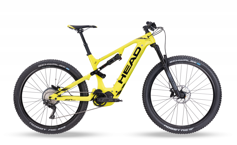Gelbes Muret II E-Mountainbike Gelbes Muret II EP8 Carbon E-Mountainbike, Seitenansicht. RockShox Federung, Mullet Wheels und Shimano Bremsen sichtbar.
