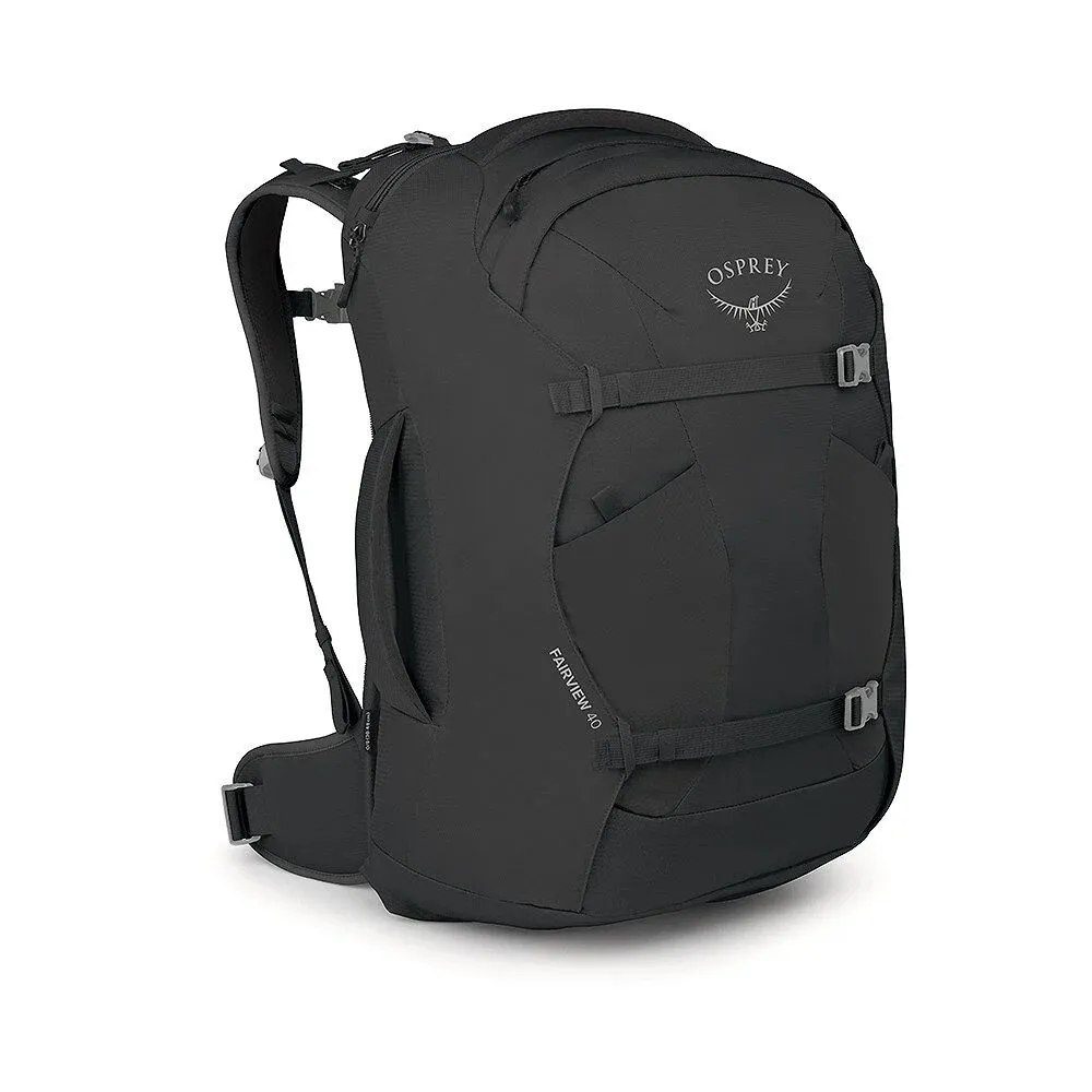 Black Osprey Fairview 40 travel backpack, shown upright with the front and left side visible. Padded shoulder straps, side carry handle, compression straps on the front, and Osprey logo visible on top. Ideal as carry-on luggage.