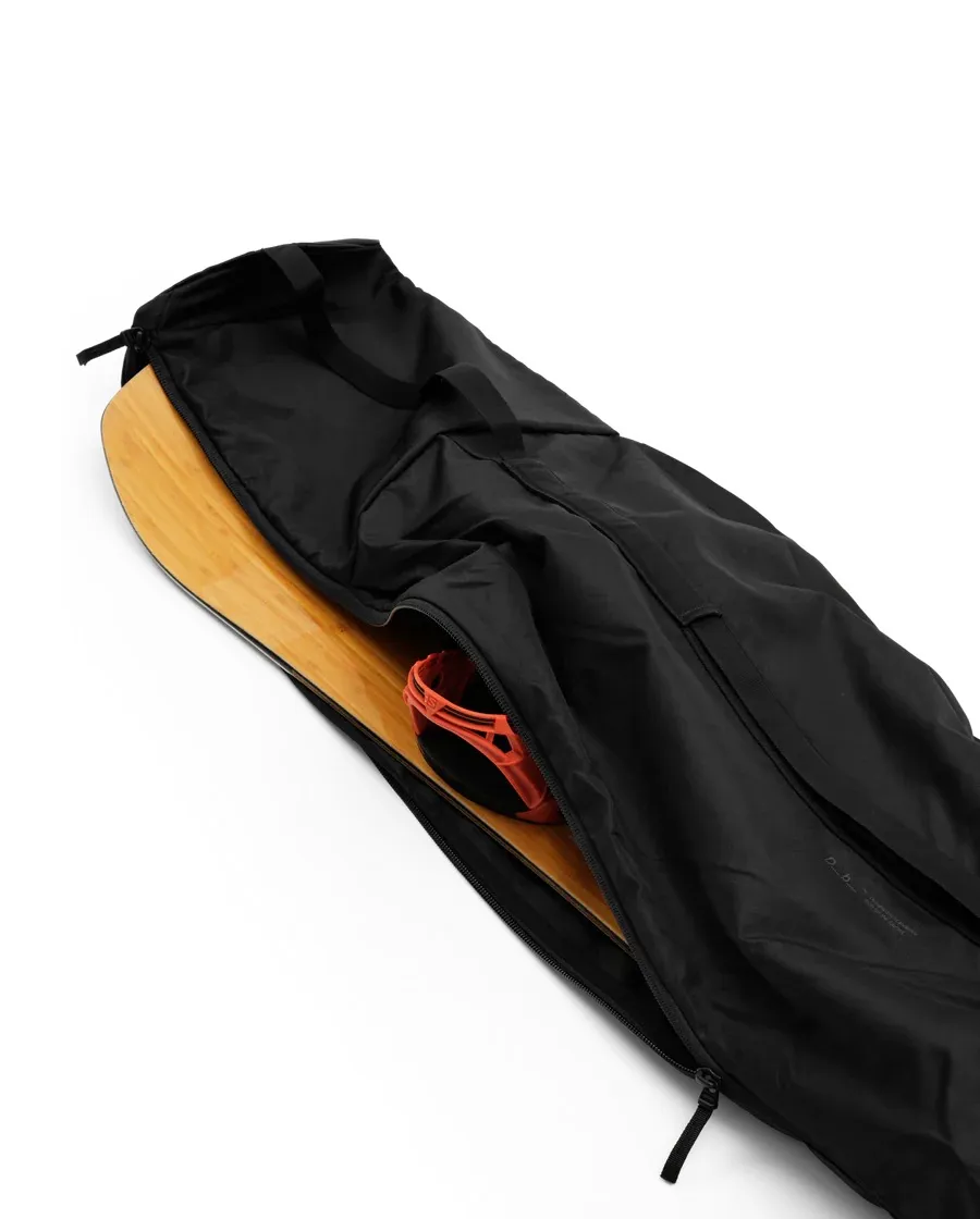 Opened, black snowboard bag, with a snowboard, a binding and carrying handles.