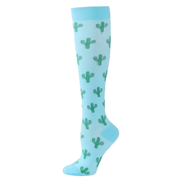 Cactus pattern ski sock Turquoise ski sock with a repeated green cactus pattern. The sock reaches to the knee.