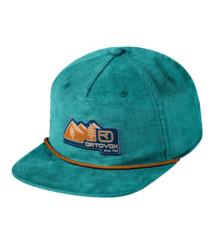 Grüne Ortovox Cap aus Cord mit Badge-Logo, seitliche Luftlöcher und Kordelband am Schirm.