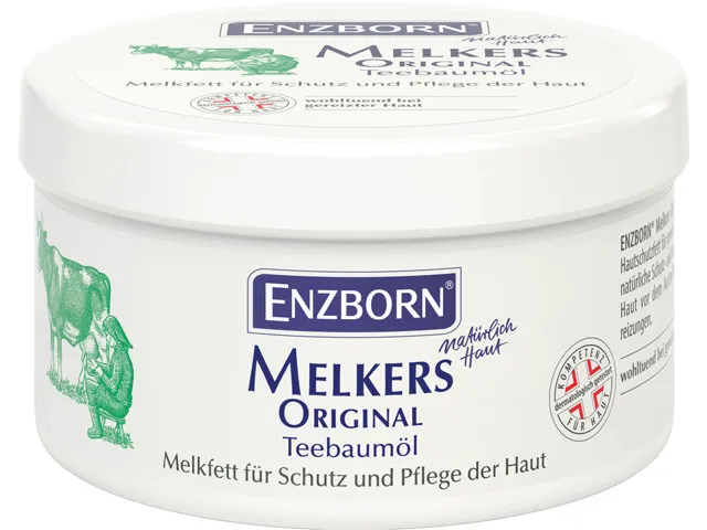 Tin Enzborn Melkers Original Tea Tree Oil, with cow and milker illustration. Milking fat for skin protection and care.