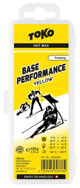 Gelber Wachsblock: Toko Base Performance Yellow für Ski, mit Skifahrer-Symbolen und Temperaturangaben.