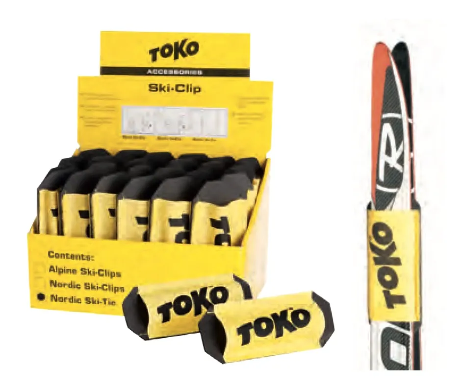 Yellow display box with Toko Ski Tie Nordic Clips and a pair of cross-country skis with clip.