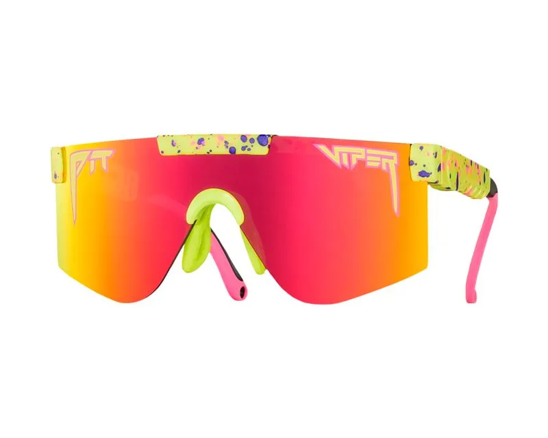 Vista frontale: occhiali da sole Pit Viper XS, lenti rosse, montatura giallo-verde con spruzzi di colore.