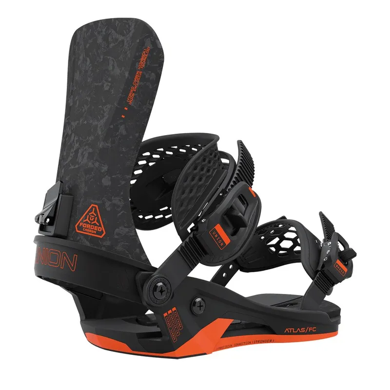 Close-up: Union Atlas FC Forged snowboard binding, black and orange, with Forged Carbon Highback.