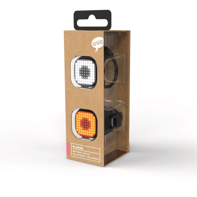 Verpackung des Lichtset Blinder Mini Square, mit Front- und Rückleuchte, LED-Leuchten in Weiß und Orange sind sichtbar.