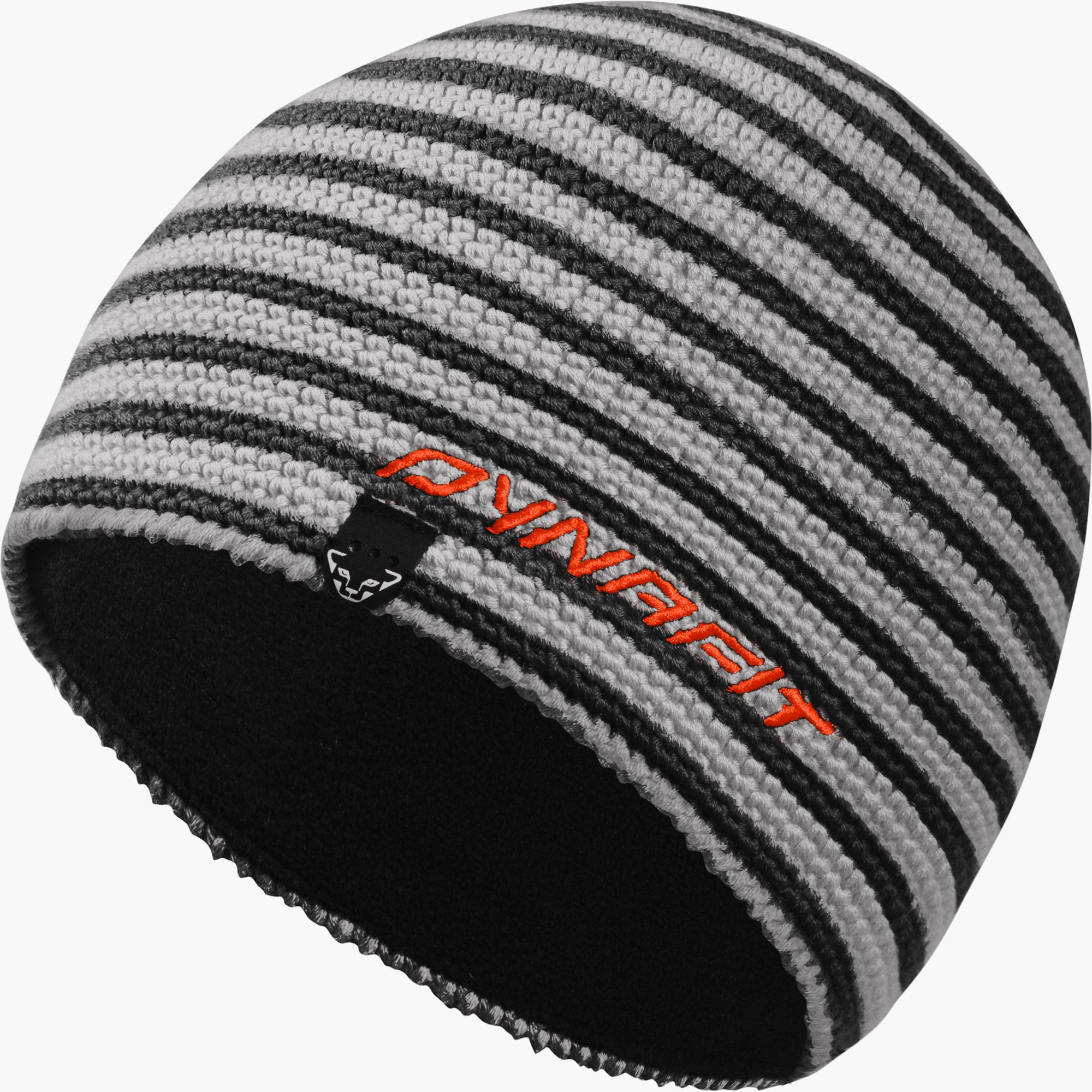 Bonnet tricoté à la main Dynafit en rayures grises et noires, avec logo orange et doublure polaire noire.