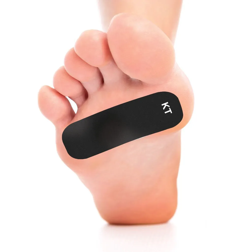 Foot with black, rectangular blister plaster with "KT" logo on the big toe.