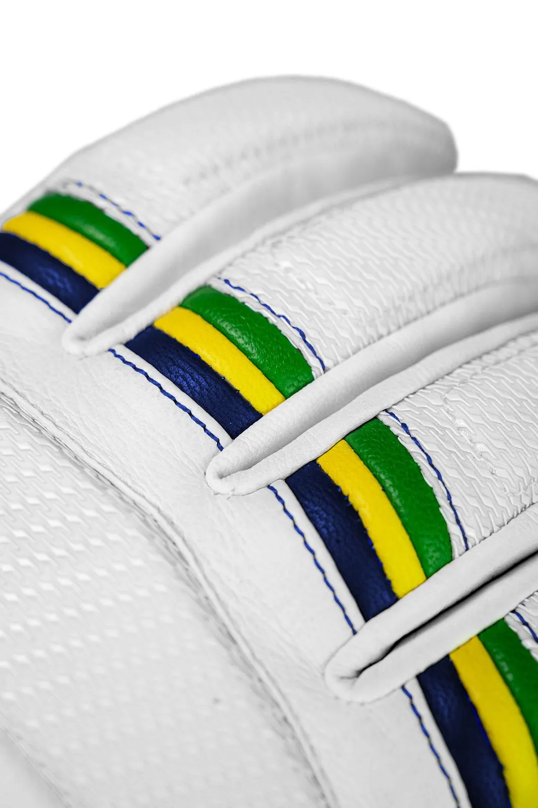 Close-up of a white glove with green, yellow and blue stripes.