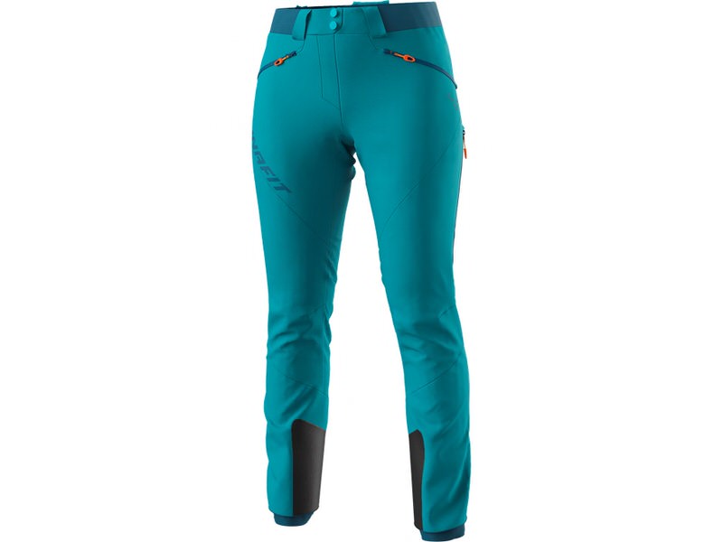 Petrolfarbene Dynafit TLT Touring Damen Skitourenhose, Frontansicht. Details: Taschen mit orangen Zips und dunkle Verstärkungen am Beinende.