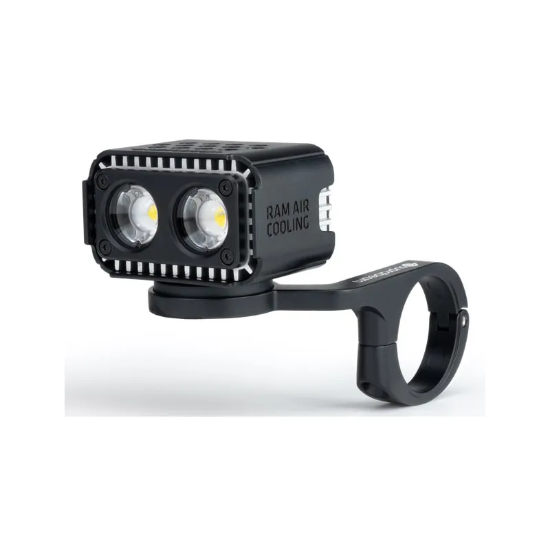 Black Suprabeam B6r bicycle light with holder. The housing has cooling fins and two round LEDs. "RAM AIR COOLING" lettering.