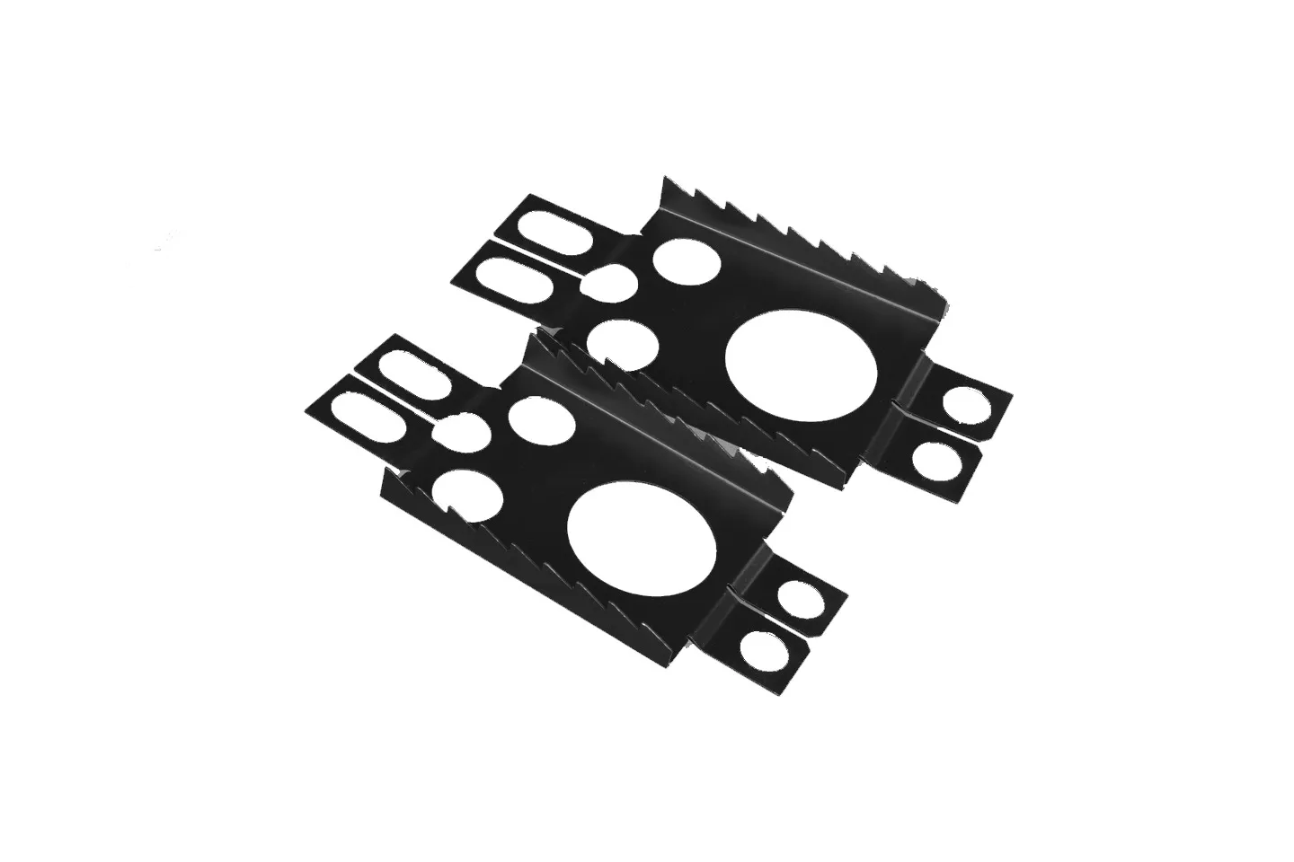 Two black Crossblades crampons with prongs and cut-outs lie diagonally on a white background.