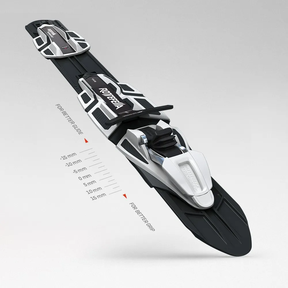 Close-up of the cross-country ski Rossignol Delta Comp R-Skin Stiff with mounted Turnamic binding on a gray background.