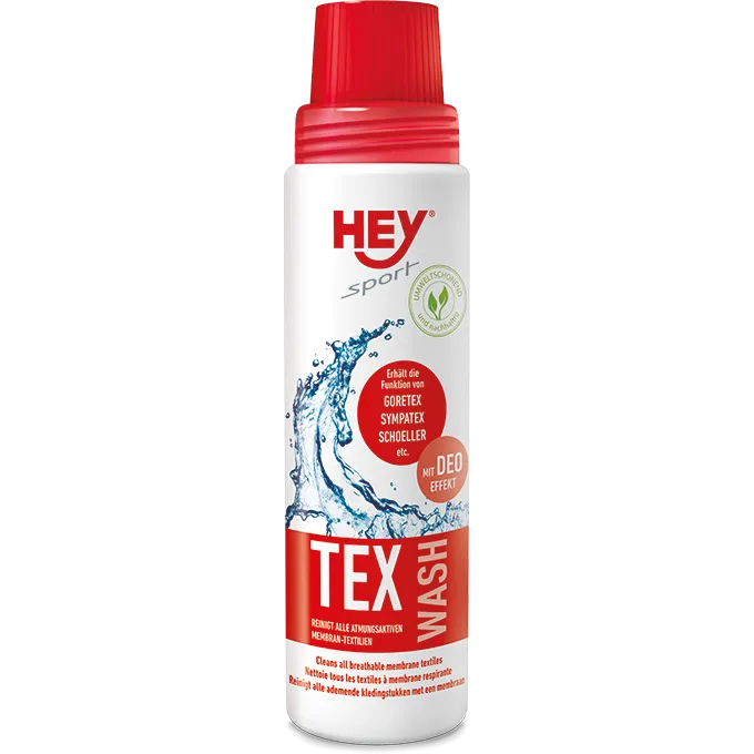 Weiße Flasche mit rotem Deckel, Aufdruck: Hey Sport Tex Wash, geeignet für Goretex, Sympatex, Schoeller Membranbekleidung.