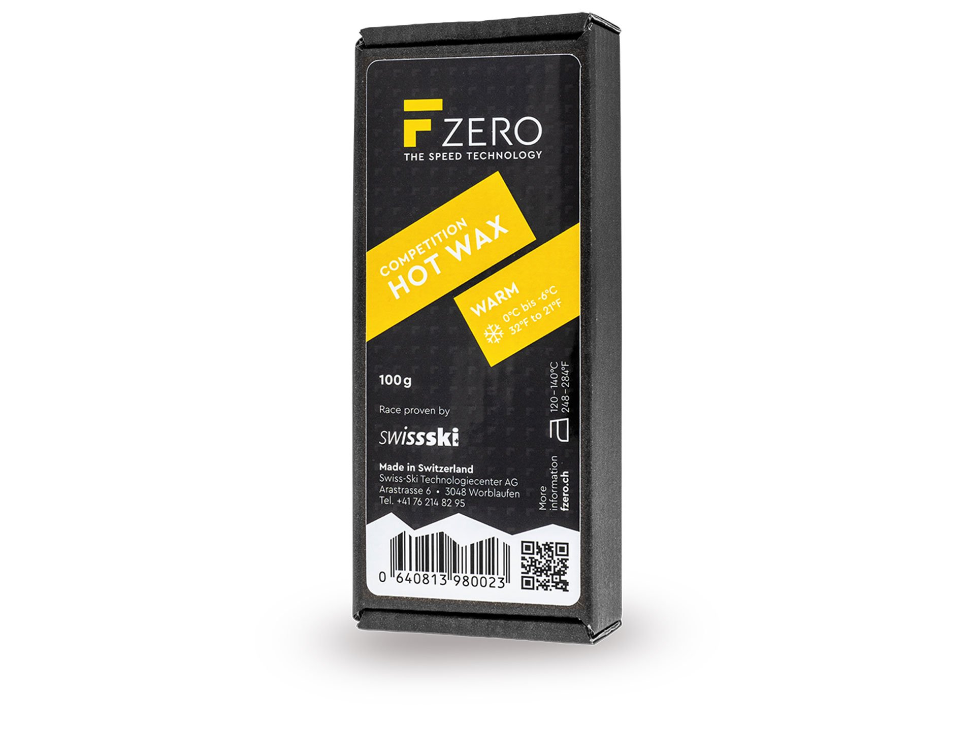 Verpackung F-Zero Hot Wax Warm 100g für Ski, mit gelben Akzenten auf schwarzem Hintergrund.