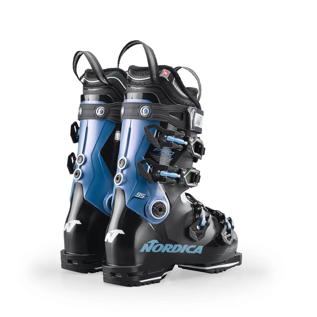 Black and blue Nordica Promachine 95 W GW ski boots from the back with buckles.